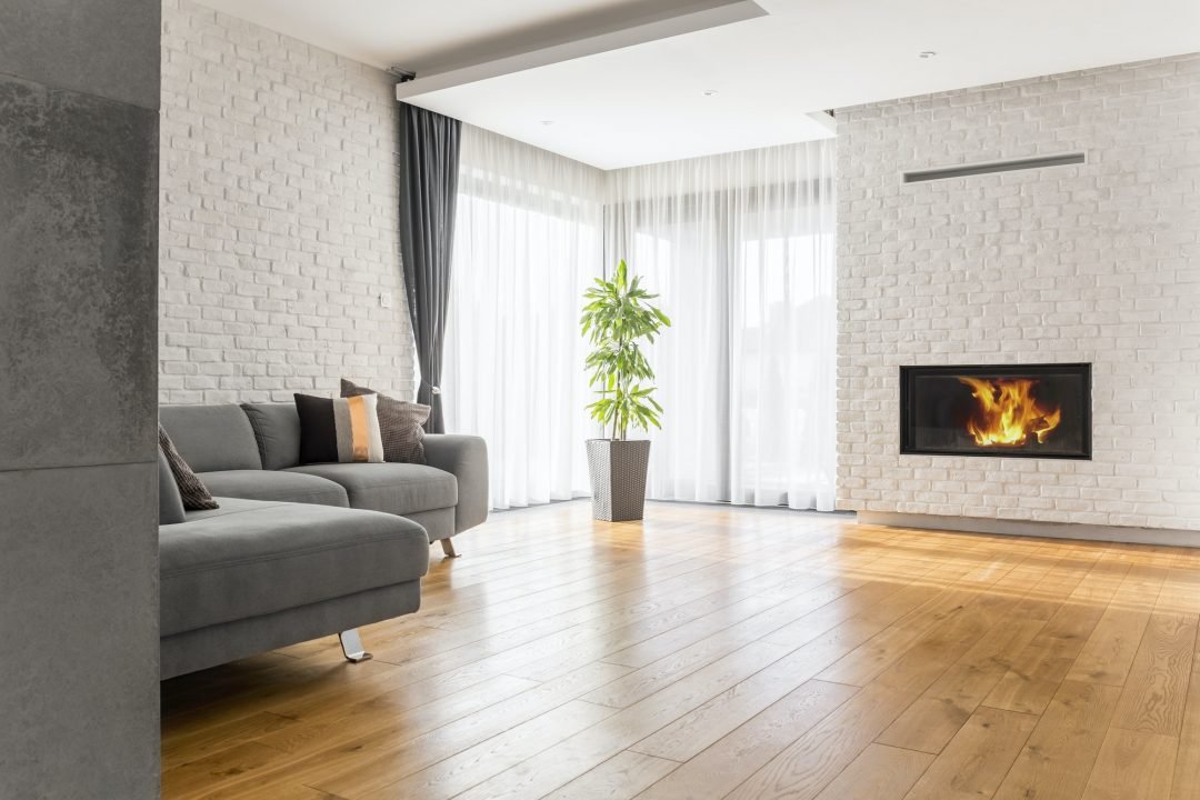 Flooring contractor installing living room planks